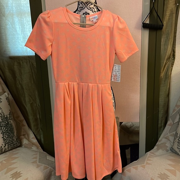 Cream designs over peach/neon orange.-DONATED - Picture 1 of 9